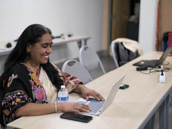 Woman in front of laptop computer
