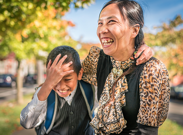 Huyen and her son Andrew smiling and hugging