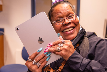 Resident holding an ipad