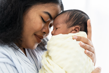 Stock image of a newborn and mother