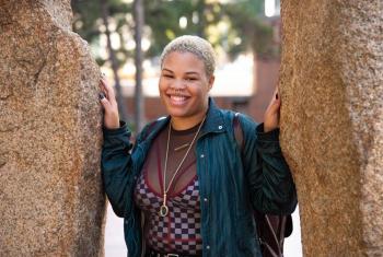 Woman standing and smiling