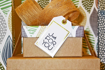 Examples of gifts wrapped in eco-friendly materials with text "Just for you"