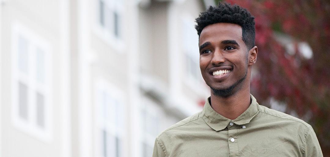 Young man standing in front of building