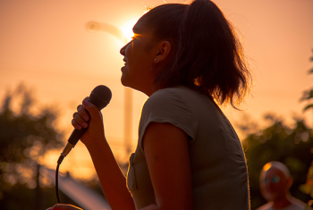 Photo of a girl singing at National Night Out