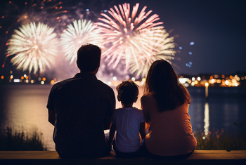 Stock image of family looking at fireworks display
