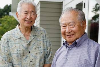 Two senior men standing