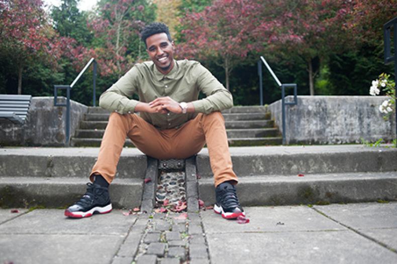 Young man sitting on steps