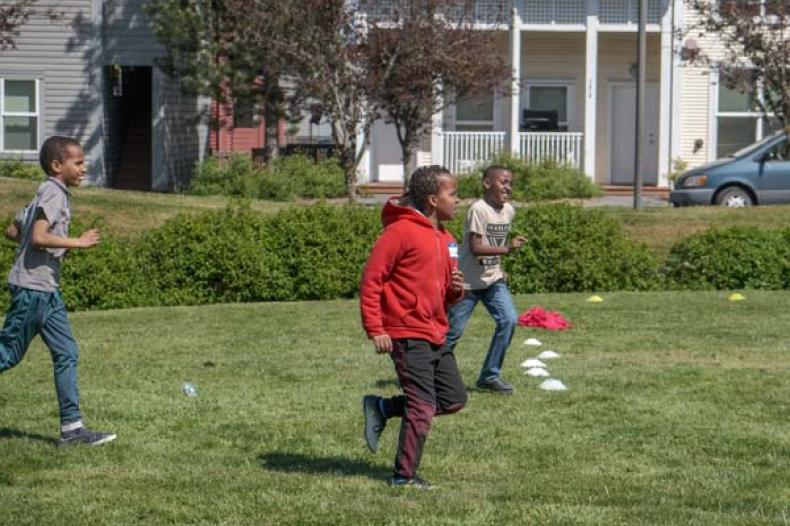 Boys running on a field