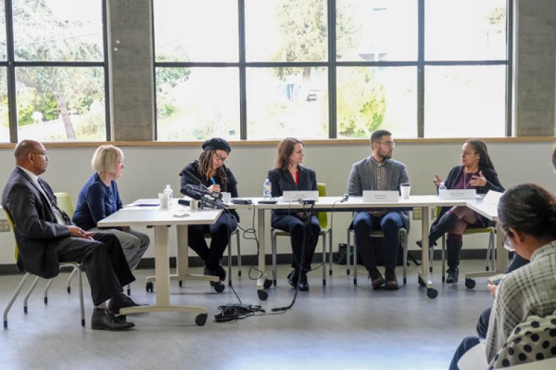 SHA Executive Director Andrew Lofton with Senator Patty Murray and others at a table 
