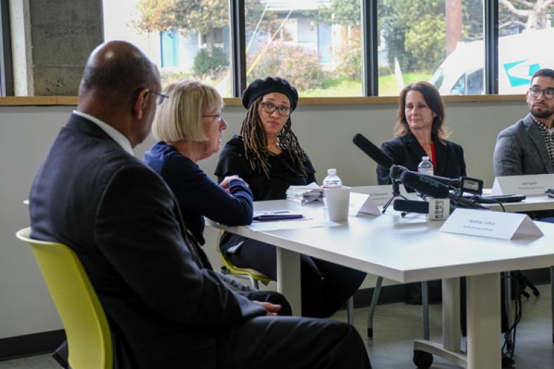 SHA Executive Director Andrew Lofton and Senator Patty Murray at table with others at Yesler