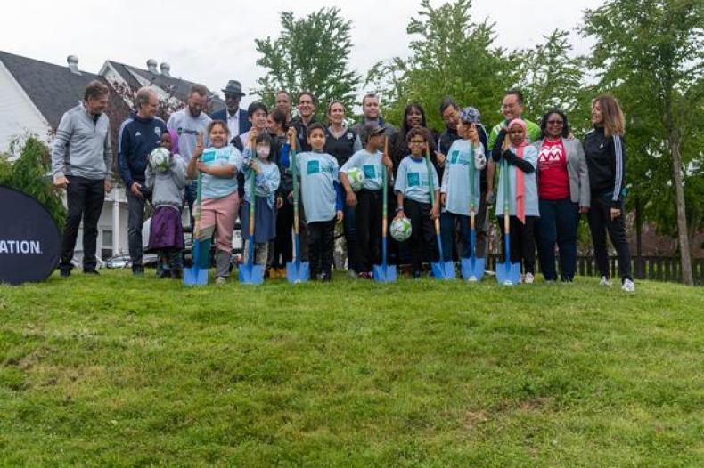 Group image of children holding shovels pictured with SHA Executive Director Rod Brandon, Brad Evans, Adrian Hanauer, Thach Nguyen, Brian Schmetzer