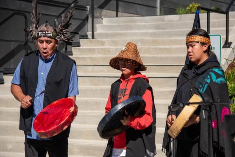 John Etzel, Native name YEXPILEM,  his son Heli Etzel, Native name KÁNTELÁNEW̱, and granddaughter, Jordyn Seymour, Native name TELÁNEW̱OT, from theTSAWOUT First Nation people of British Columbia