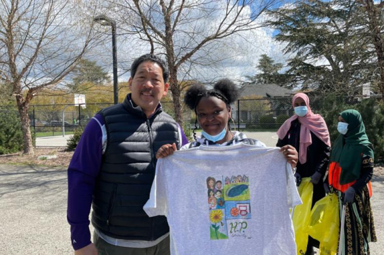 Mayor Bruce Harell with teen holding a t shirt 