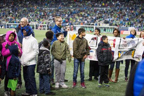 Yesler kids display goal post designs at Sounders game halftime