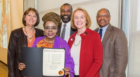 SHA Executive Director Andrew Loften, Seattle Mayor Jenny Durkan and others holding proclamation paper