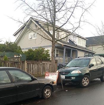 No parking sign and cars on street