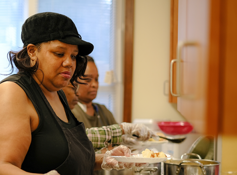 Woman serves food