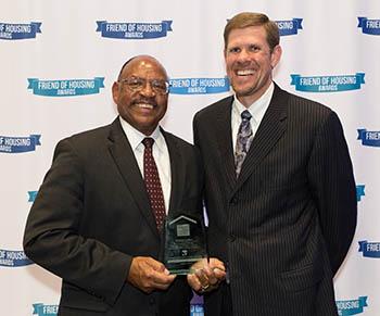Andrew Lofton holds Friend of Housing Award