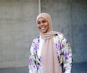 Khadra smiling and standing