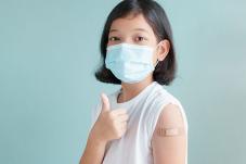 Girl with face covering