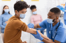 Young man getting vaccine