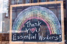 Chalkboard sign that reads "Thank you essential workers"