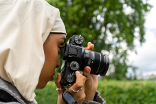 Stock image of young woman with camera