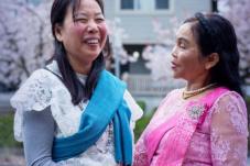 2024 Annual Report cover - two women standing in front of a house