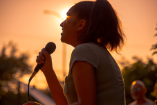 Photo of a girl singing at National Night Out