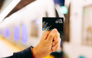 Image of person holding ORCA card
