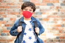 Boy with face covering