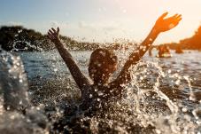 Child playing in lake
