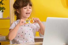 Girl looking at laptop computer screen