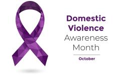 'Purple ribbon and text: 'Domestic Violence Awareness Month