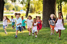 Image of kids running at a park