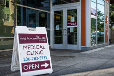 Image of sandwich board with text that says Neighborcare Health