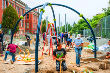 Image of people building a playground