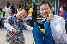 Son and father at NewHolly Fun fair