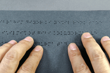 Hands reading braille