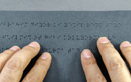Blind person reading braille