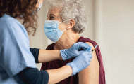 Elderly woman getting injection