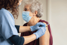 Elderly woman getting vaccine