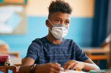 Teen boy wearing a mask
