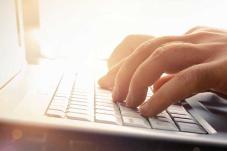 Hands typing on keyboard