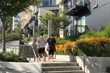 Photo of two people at Yesler