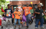 Kids dancing in front of community center building