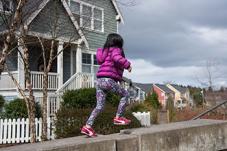Girl running on a wall