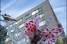 Residential building with sculpture in front of it