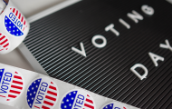 "Voting day" sign and "I voted" stickers