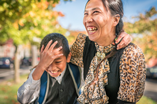 Huyen and her son Andrew smiling and hugging